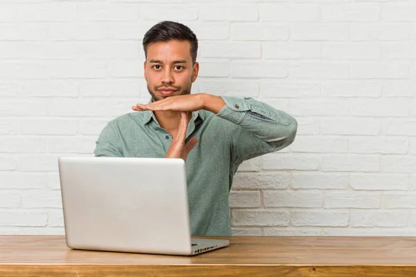 Young Filipino Man Sitting Working His Laptop Showing Timeout Gesture — Stock Photo, Image