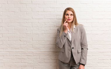 Young russian business woman holding something with hands