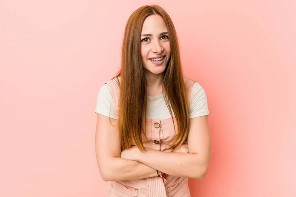 Young ginger woman with freckles laughing and having fun.