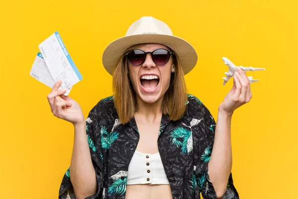 Young caucasian woman holding air tickets very happy. — Stock Photo, Image