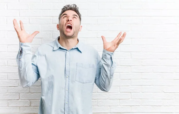 Young Handsome Man Bricks Wall Screaming Sky Looking Frustrated — Stock Photo, Image