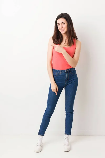 Full Body Young Woman White Background Smiling Pointing Aside Showing — Stok fotoğraf