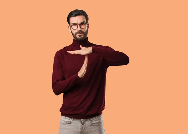 Young natural man doing a timeout gesture