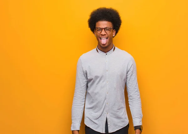 Young African American Man Orange Wall Funnny Friendly Showing Tongue — Stock Photo, Image