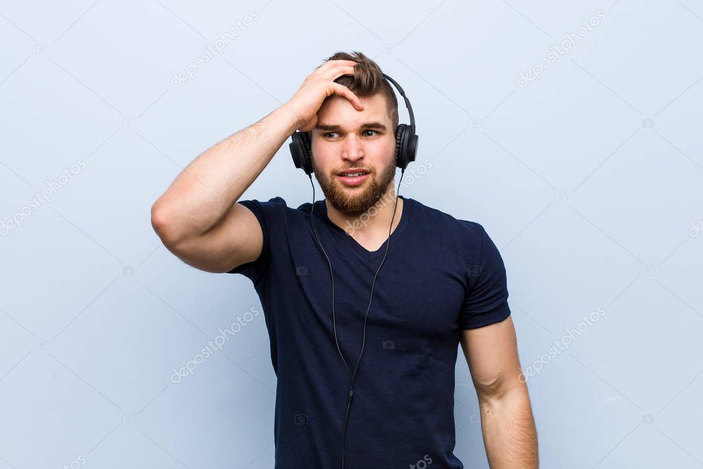 Young caucasian man listening to music being shocked, she has remembered important meeting.