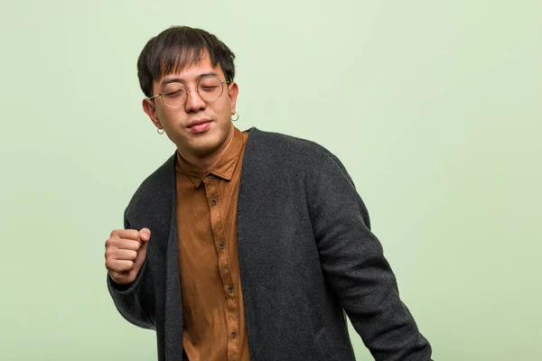 Young Chinese Man Wearing Cool Clothes Style Green Background — Stock Photo, Image