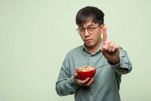 Young Chinese Man Eating Cereals Bowl — Stock Photo, Image