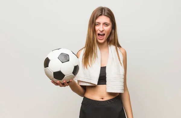 Young Fitness Russian Woman Screaming Very Angry Aggressive Holding Soccer — Stock Photo, Image