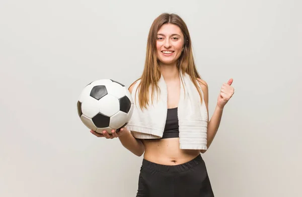 Young Fitness Russian Woman Surprised Shocked Holding Soccer Ball — Stock Photo, Image