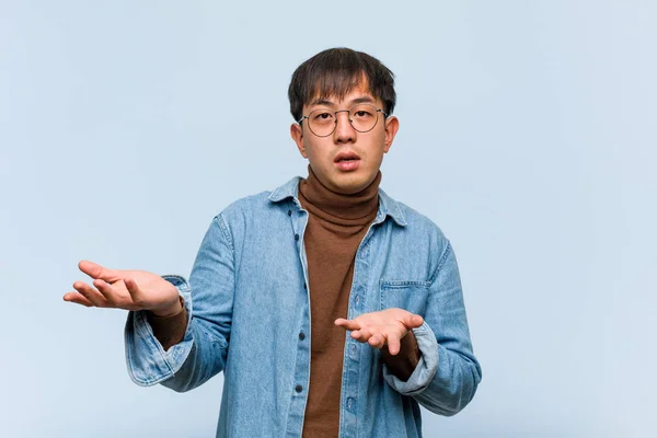 Young Chinese Man Confused Doubtful — Stock Photo, Image