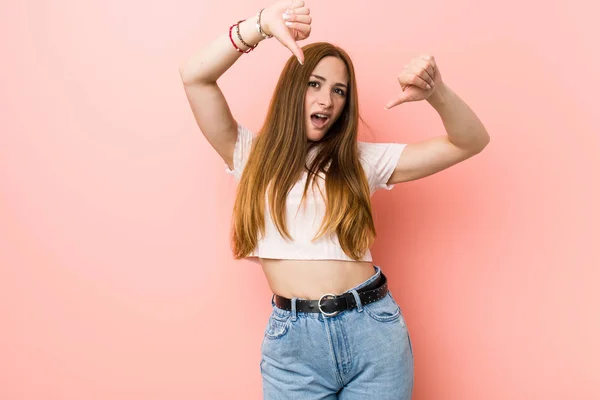 Young Redhead Ginger Woman Pink Wall Showing Thumb Expressing Dislike — Stock Photo, Image