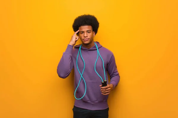 Young African American Sport Man Holding Jump Rope Thinking Idea — Stock Photo, Image