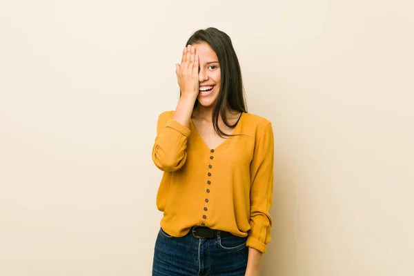 Young Hispanic Woman Beige Background Having Fun Covering Half Face — Stock Photo, Image