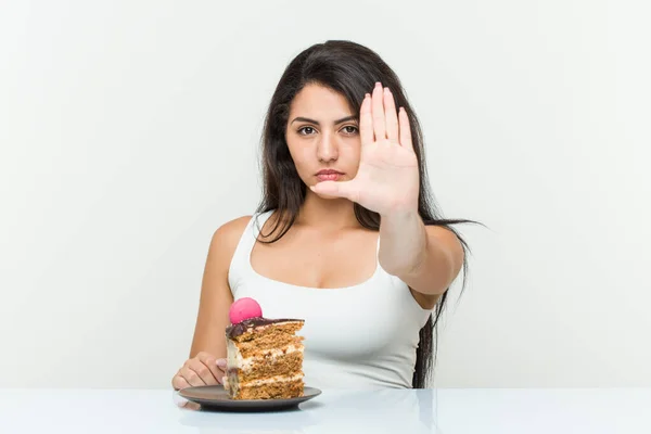 Young Hispanic Woman Eating Cake Standing Outstretched Hand Showing Stop — Stock Photo, Image