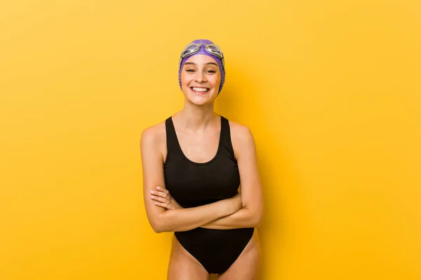 Young swimmer caucasian woman laughing and having fun.