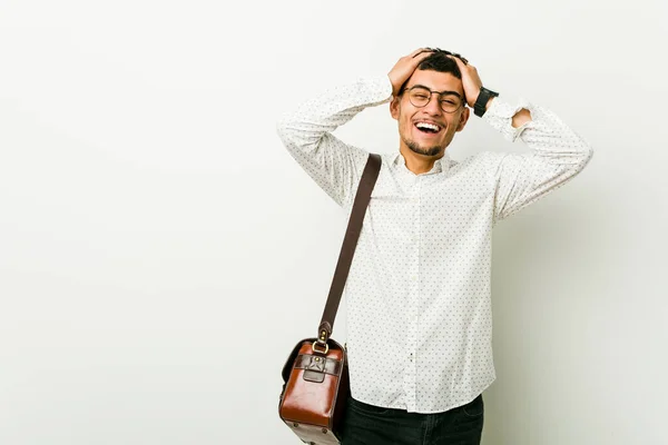 Young Hispanic Casual Business Man Laughs Joyfully Keeping Hands Head — Stock Photo, Image