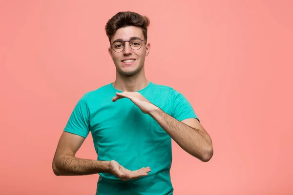 Young Cool Caucasian Man Holding Something Both Hands Product Presentation — Stock Photo, Image