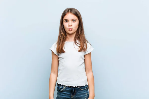 Cute Girl Blows Cheeks Has Tired Expression Facial Expression Concept — Stock Photo, Image