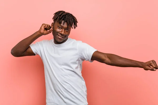 Young african black man dancing and having fun.