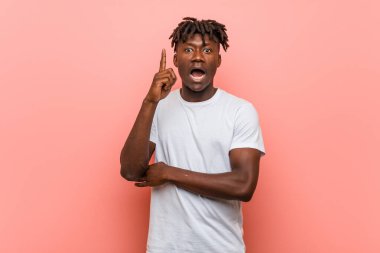 Young african black man having some great idea, concept of creativity.