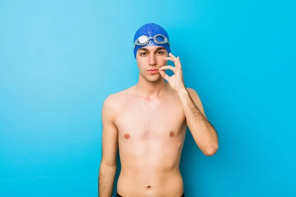 Young Swimmer Man Fingers Lips Keeping Secret — Stock fotografie