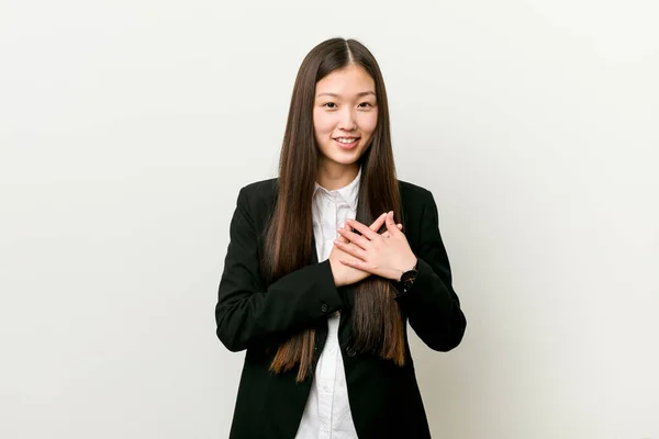 Young Pretty Chinese Business Woman Has Friendly Expression Pressing Palm — Stock Photo, Image