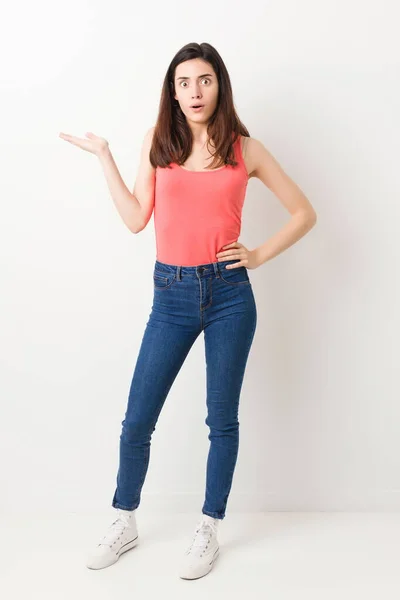 Full Body Young Woman White Background Impressed Holding Copy Space — Stock Photo, Image