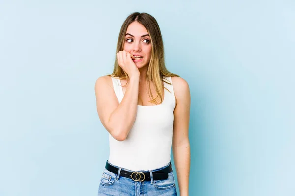Young Caucasian Woman Isolated Blue Background Biting Fingernails Nervous Very — Stock Photo, Image