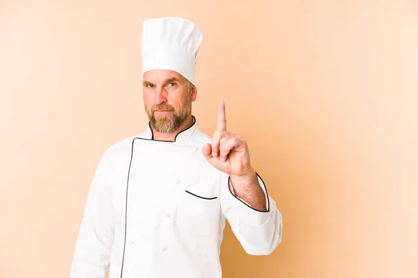 Chef Man Isolated Beige Background Showing Number One Finger — Stock Photo, Image