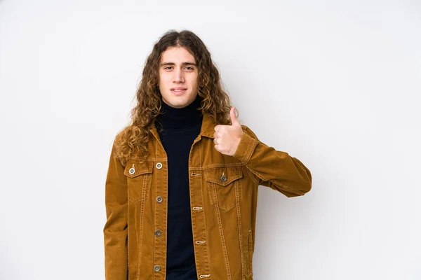 Long hair man posing isolated smiling and raising thumb up