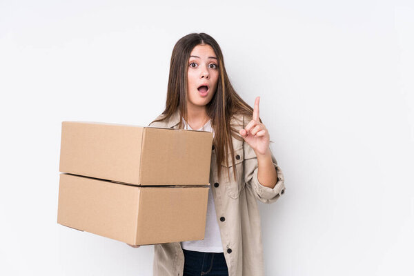 Young caucasian woman moving to a new home having an idea, inspiration concept.