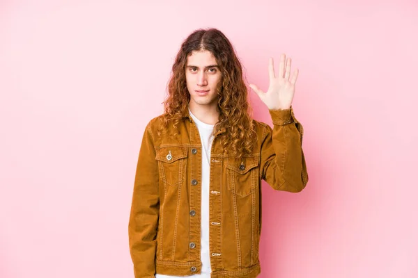 Young long hair man posing isolated smiling cheerful showing number five with fingers.
