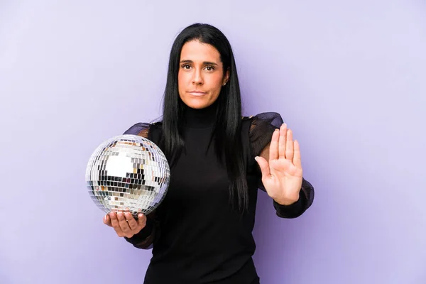 Woman Holding Ball Party Isolated Purple Background Standing Outstretched Hand — Stock Photo, Image