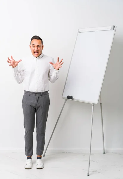 Young Latin Coaching Man Whiteboard Isolated Screaming Rage — Stock Photo, Image