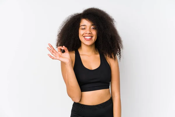 Young African American Sporty Woman Winks Eye Holds Okay Gesture — Stock Photo, Image