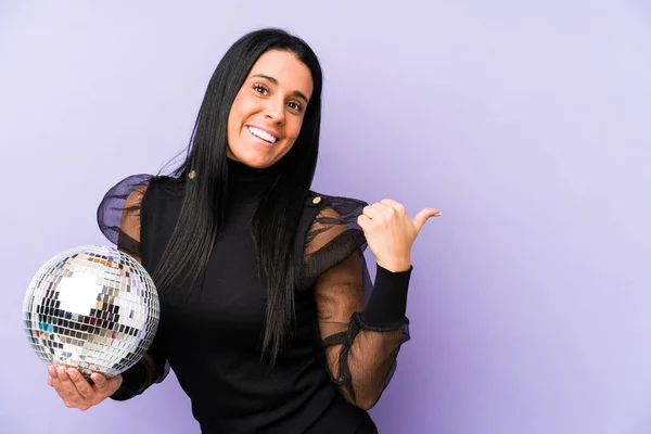 Woman Holding Ball Party Isolated Purple Background Points Thumb Finger — Stock Photo, Image