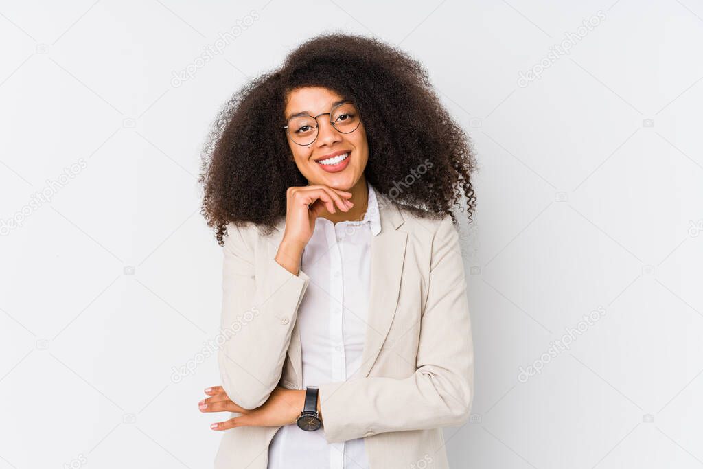 Young african american business woman smiling happy and confident, touching chin with hand.