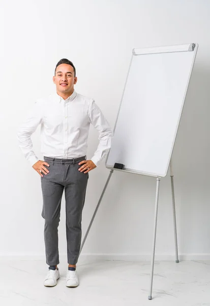 Young Latin Coaching Man Whiteboard Isolated Confident Keeping Hands Hips — Stock Photo, Image