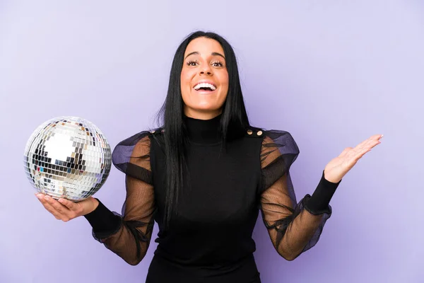 Woman Holding Ball Party Isolated Purple Background Receiving Pleasant Surprise — Stock Photo, Image