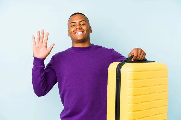 Young Traveler Man Holding Suitcase Isolated Smiling Cheerful Showing Number — Stock Photo, Image