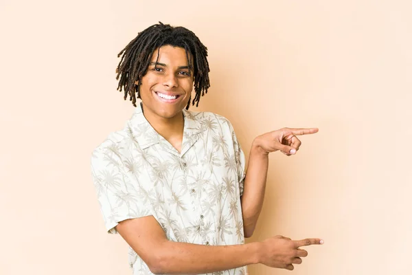 Young African American Rasta Man Excited Pointing Forefingers Away — Stock Photo, Image