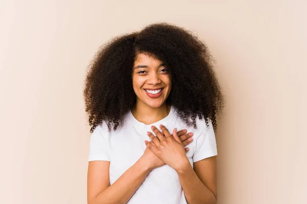 Young African American Woman Has Friendly Expression Pressing Palm Chest — Stock Photo, Image