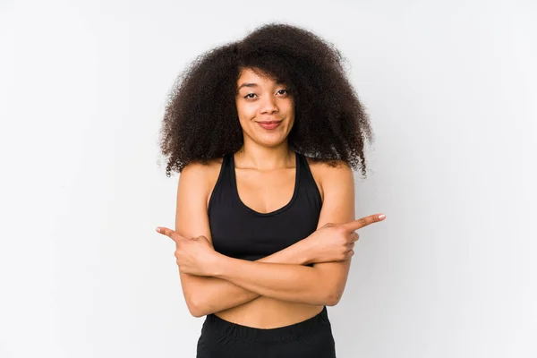 Young African American Sporty Woman Points Sideways Trying Choose Two — Stock Photo, Image