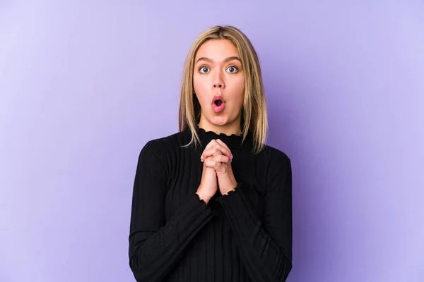 Young Blonde Caucasian Woman Isolated Praying Luck Amazed Opening Mouth — Stock Photo, Image