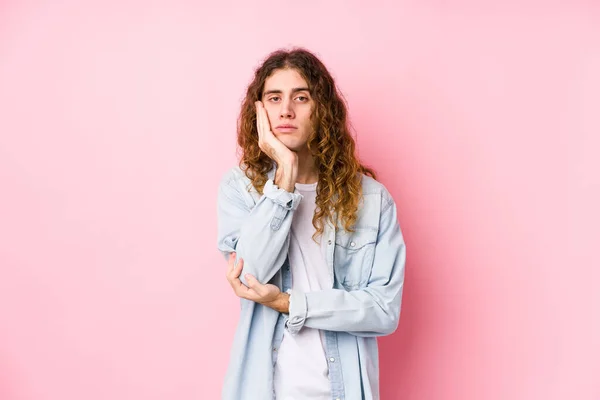 Long hair man posing isolated who is bored, fatigued and need a relax day.