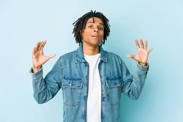 Young Black Man Wearing Jeans Jacket Holding Something Little Forefingers — Stock Photo, Image