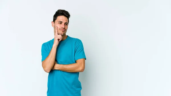 Joven Hombre Caucásico Aislado Sobre Fondo Blanco Contemplando Planeando Una —  Fotos de Stock