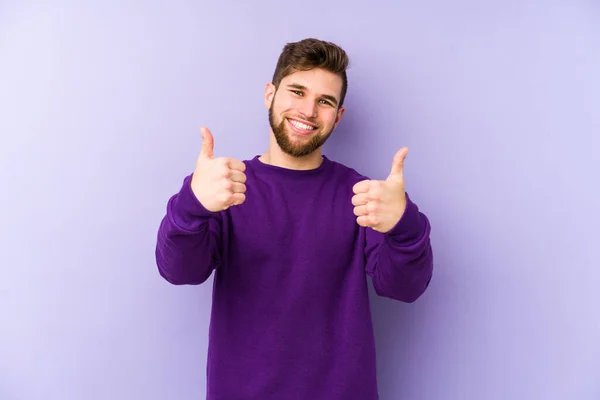 Young Caucasian Man Isolated Purple Background Smiling Raising Thumb — Stock Photo, Image