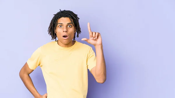 Young African American Rasta Man Pointing Upside Opened Mouth — Stock Photo, Image