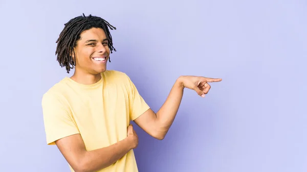 Young African American Rasta Man Smiling Cheerfully Pointing Forefinger Away — Stock Photo, Image
